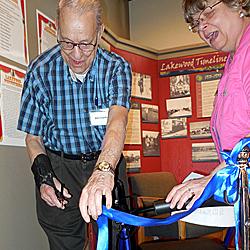 Saturday, May 9: Bill Charlton cuts the ribbon to officially open the exhibit.